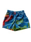 A pair of blue patterned shorts with a colorful cartoon print, featuring elmo. Made from a secondhand duvet.