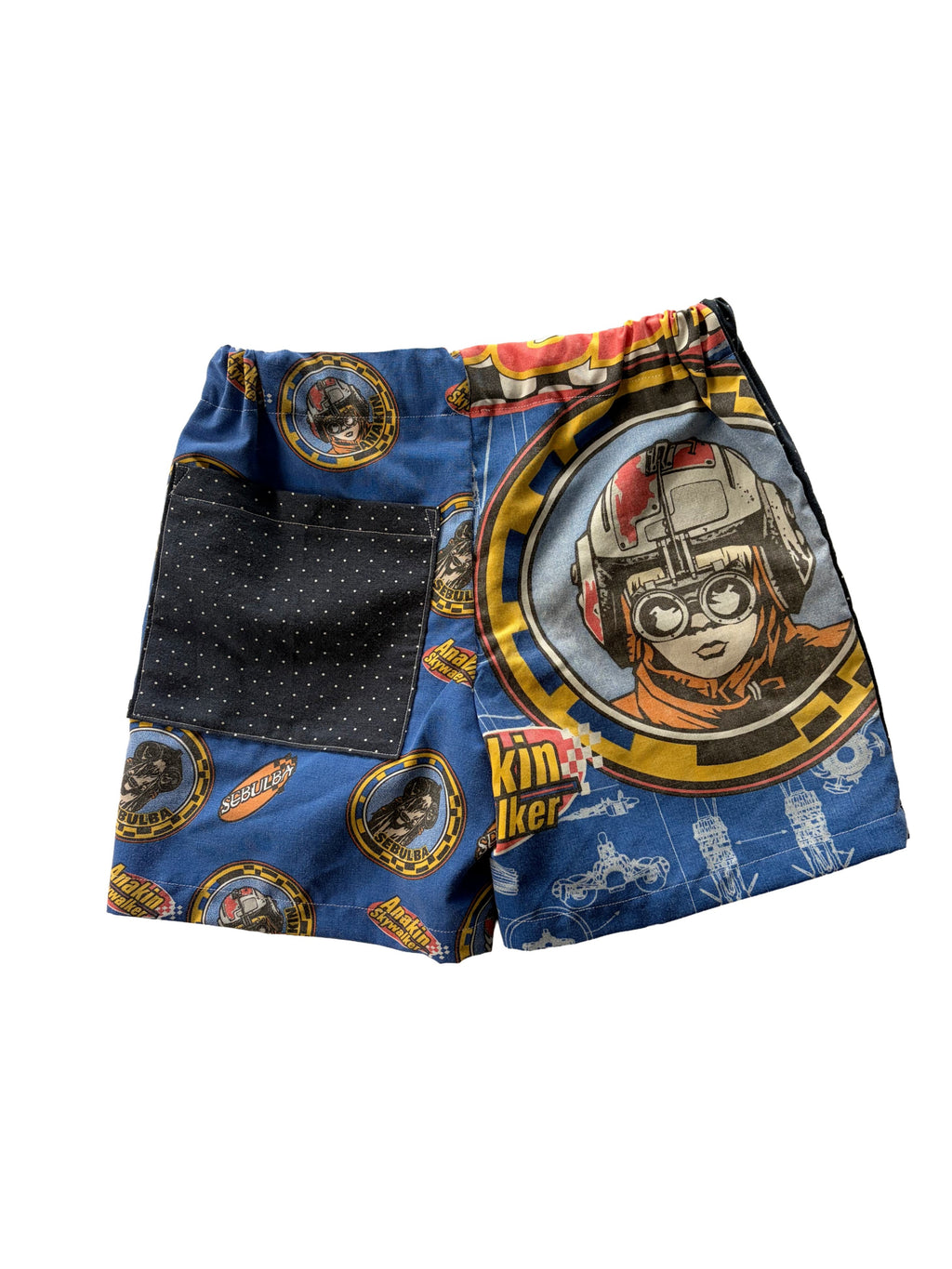 Handmade upcycled kids' shorts with a navy blue polka dot ppocket and a blue Star Wars Anakin panel, made from a secondhand duvet & dress shirt.