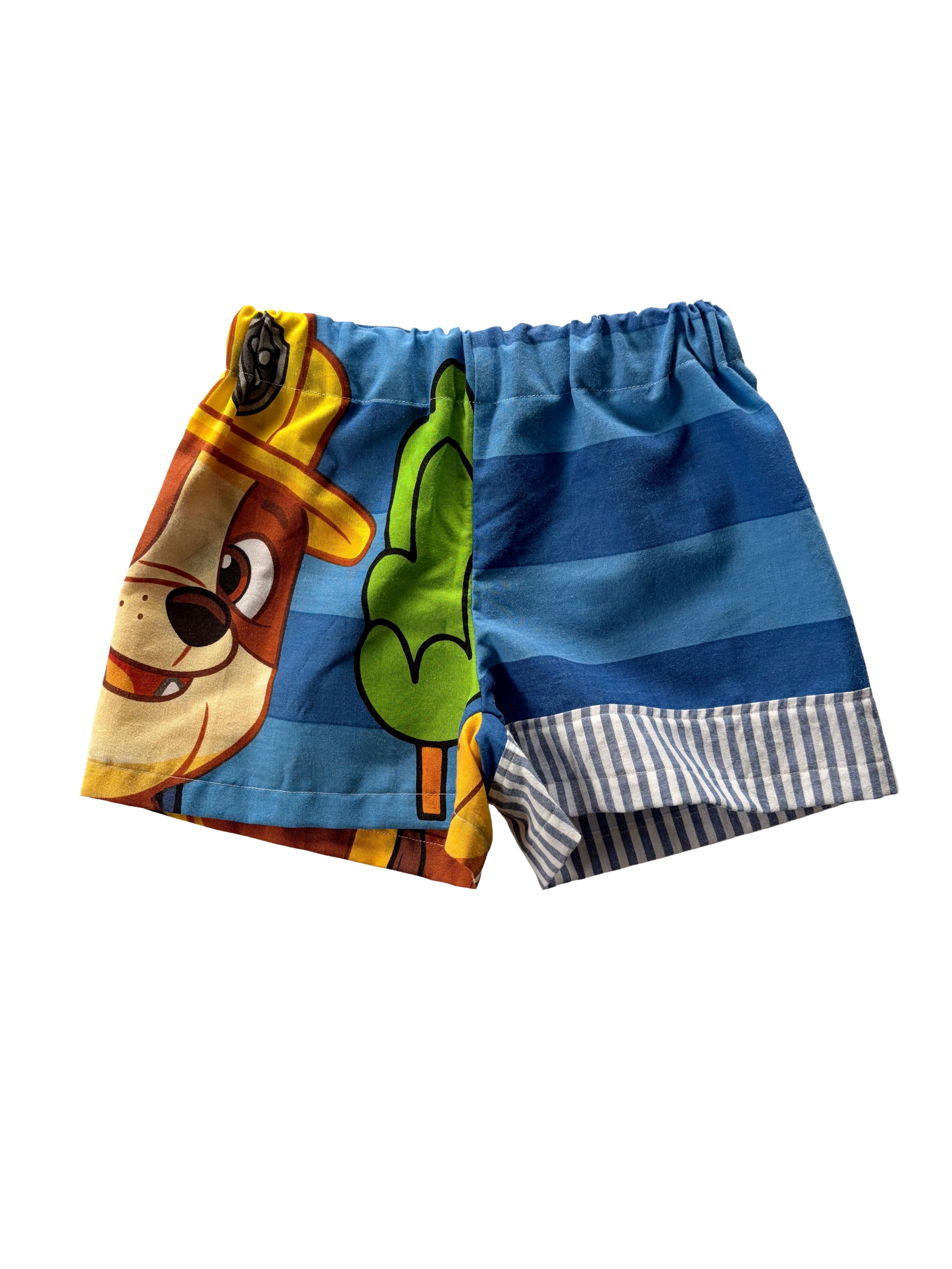 Handmade upcycled kids' shorts with blue stripes, featuring Rubble from Paw Patrol, made from a secondhand duvet.