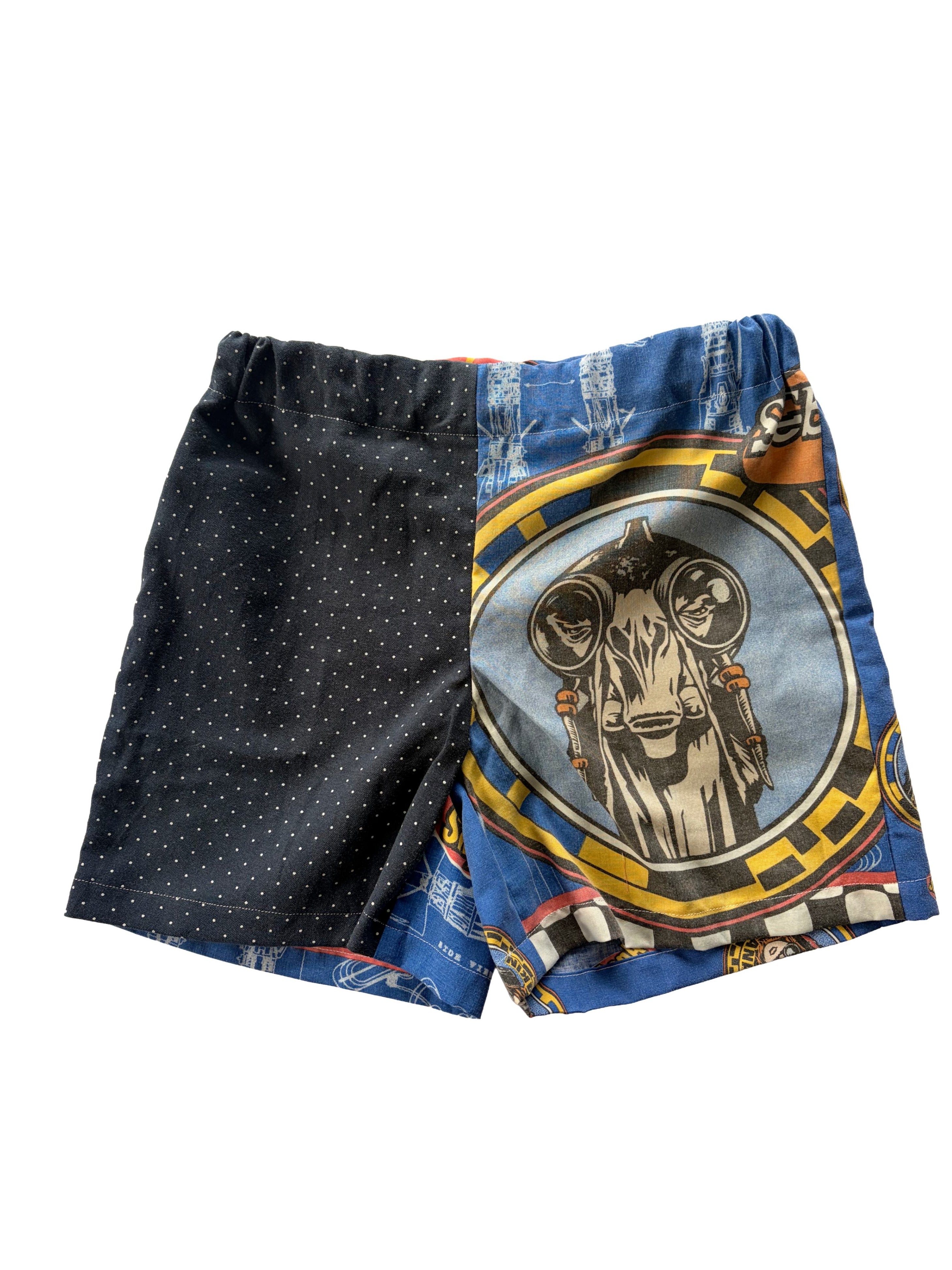 Handmade upcycled kids' shorts with a navy blue polka dot panel and a blue Star Wars print panel, made from a secondhand duvet & dress shirt.